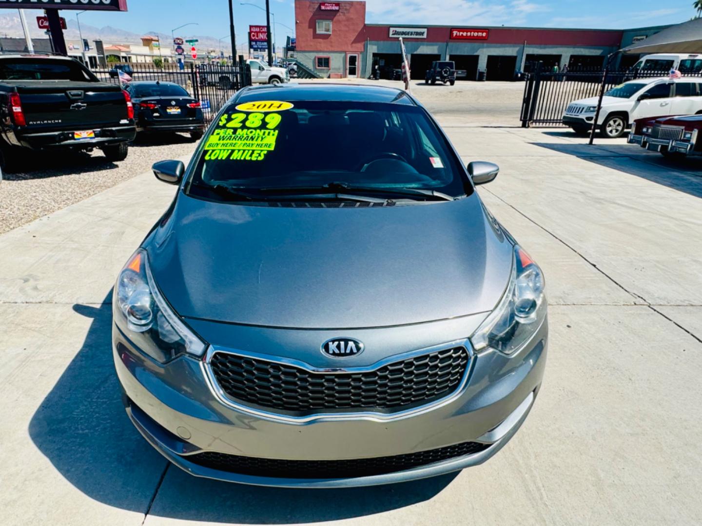 2014 grey Kia Forte (KNAFX4A86E5) , located at 2190 Hwy 95, Bullhead City, AZ, 86442, (928) 704-0060, 0.000000, 0.000000 - 2014 Kia Forte EX. 2.0 4 cylinder engine. great gas mileage. new engine with warranty. great gas mileage. brand new tires. financing available. super clean. bluetooth, backup sensors. keyless entry. satellite radio. buy here pay here. in house financing . we finance. only at Dunton Motors. - Photo#4